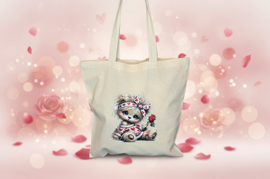 A charming canvas tote with an adorable kitty holding a single red rose for the one you love — a lovely little Valentine’s surprise. Hand‑pressed, eco‑friendly, and perfect for daily essentials or gifting.